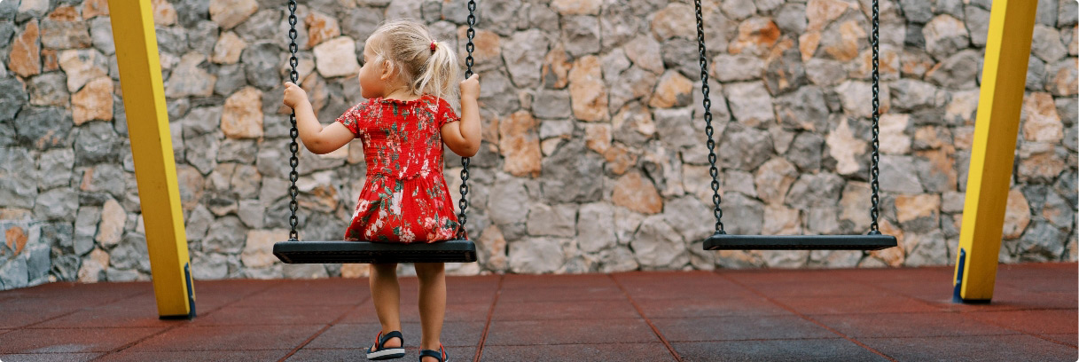 Little girl on swingset