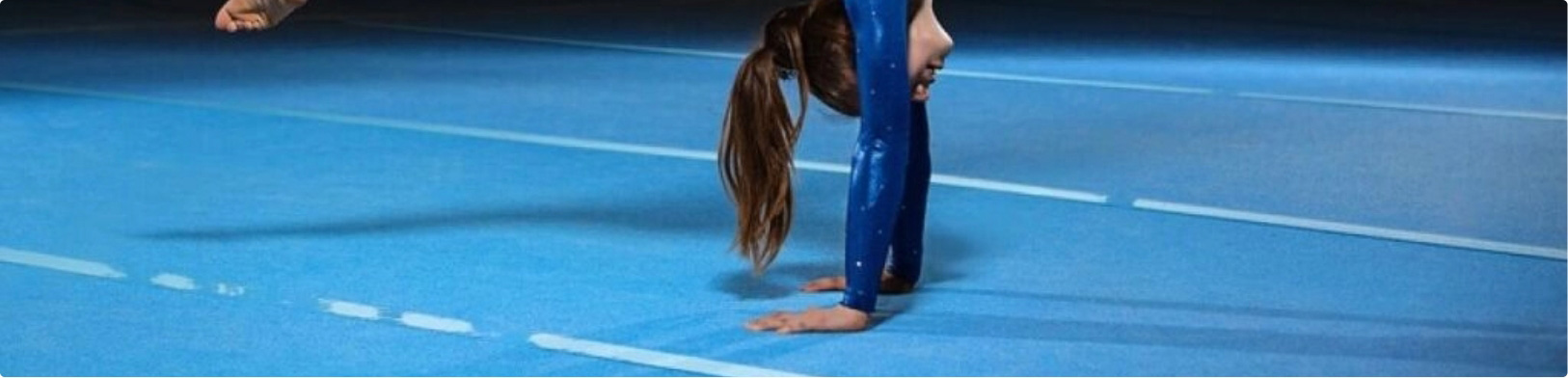 Gymnast on rubber flooring